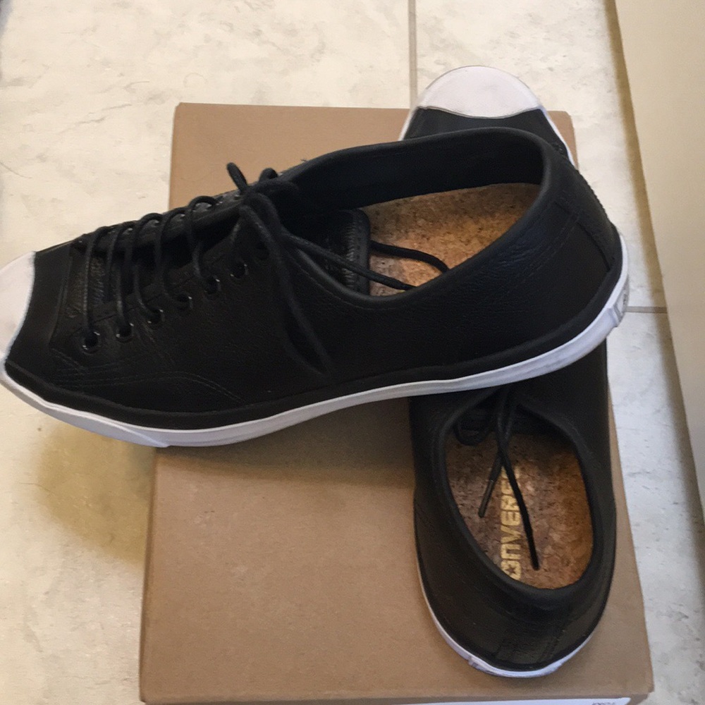 Black leather converse sneakers.